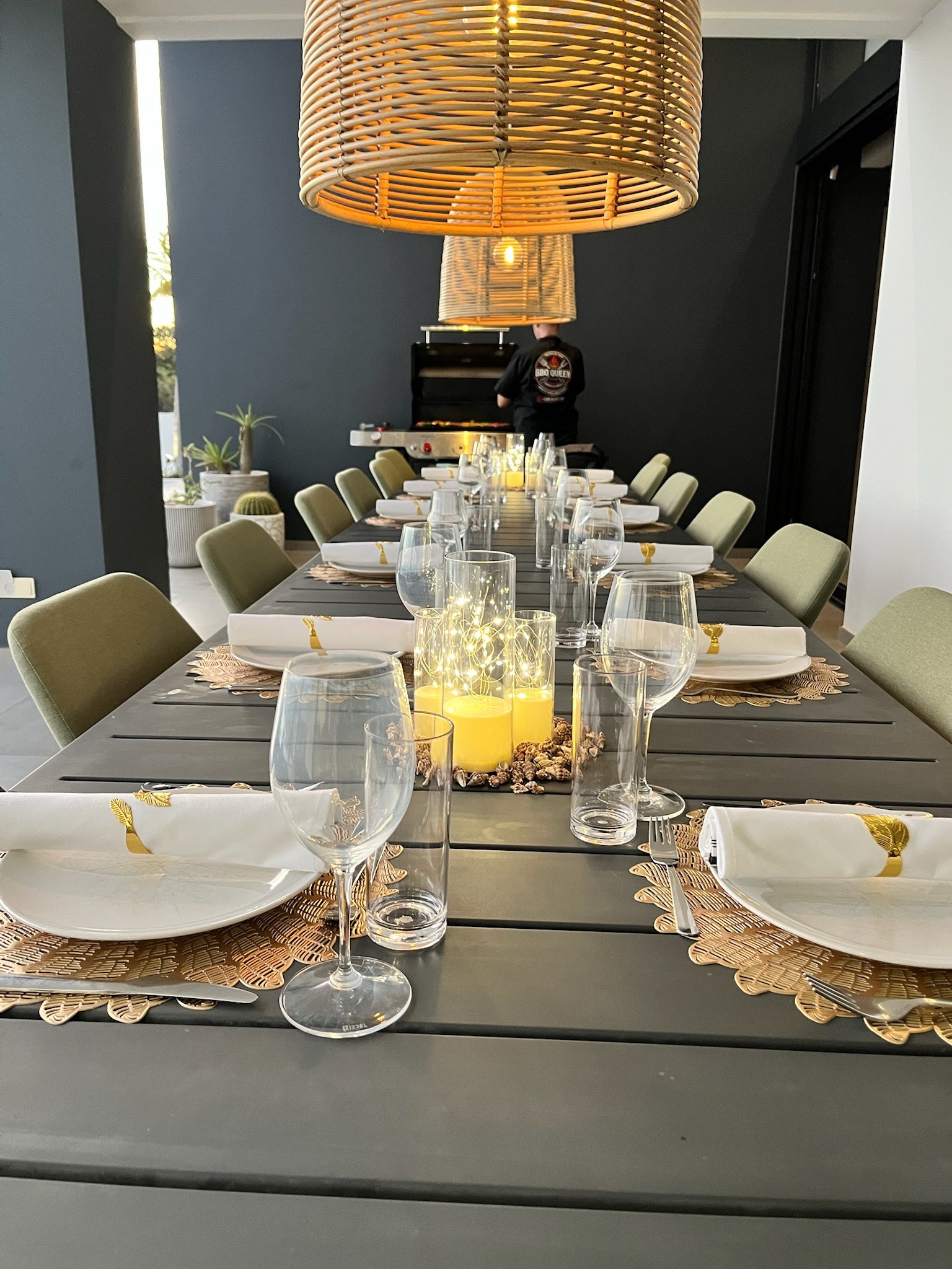 Dinner table styled with candles and place settings